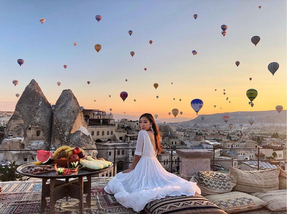 Sky, Balloon, Hot air balloon, Dress, Cloud, Bride, Landscape, Sitting, Vehicle, Tourism, 