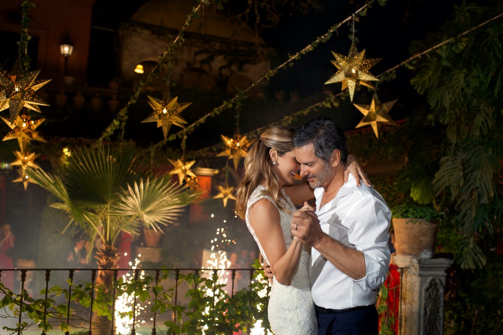 couple dancing under decorative lights and stars