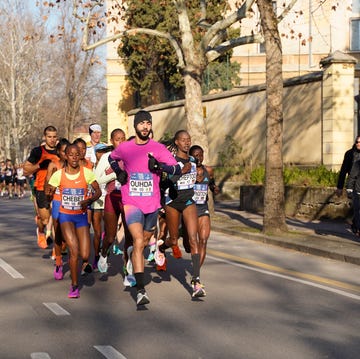 a group of people running on a street