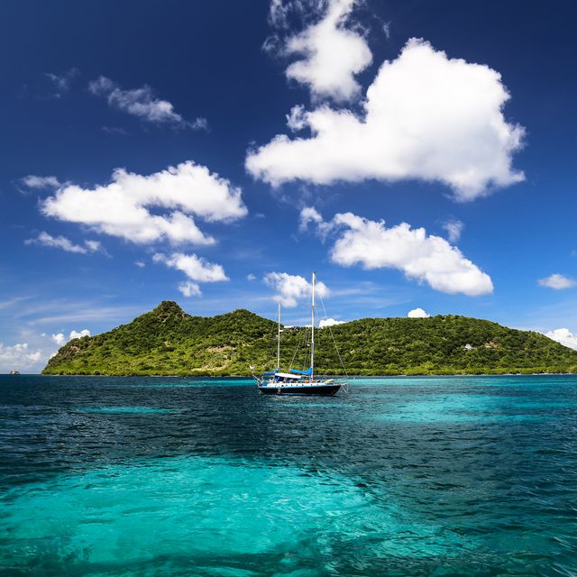 a yacht moored in the sea at carriacou, grenada