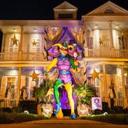a new orleans home decorated for mardi gras 2021, also known as "yardi gras"