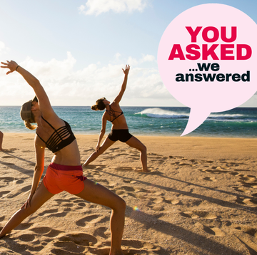 a group of women jumping on a beach