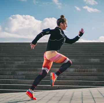 a person running on a brick surface