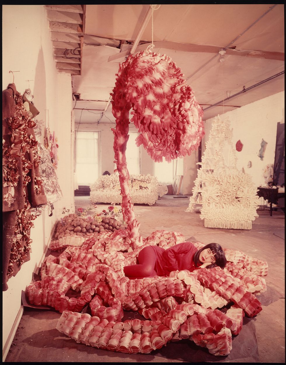 Peter Moore, Photo of Yayoi Kusama with "My
 Flower Bed" in her NYC studio, c.
 1965