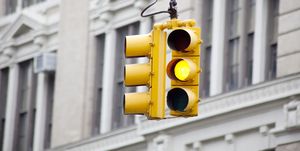Yellow caution signal on traffic light