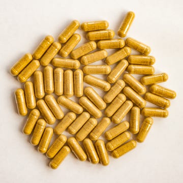 yellow color pills capsules on white background