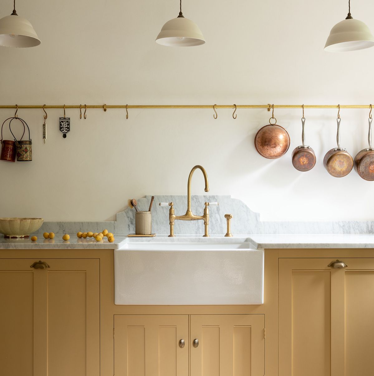 subdued yellow basement kitchen in london
