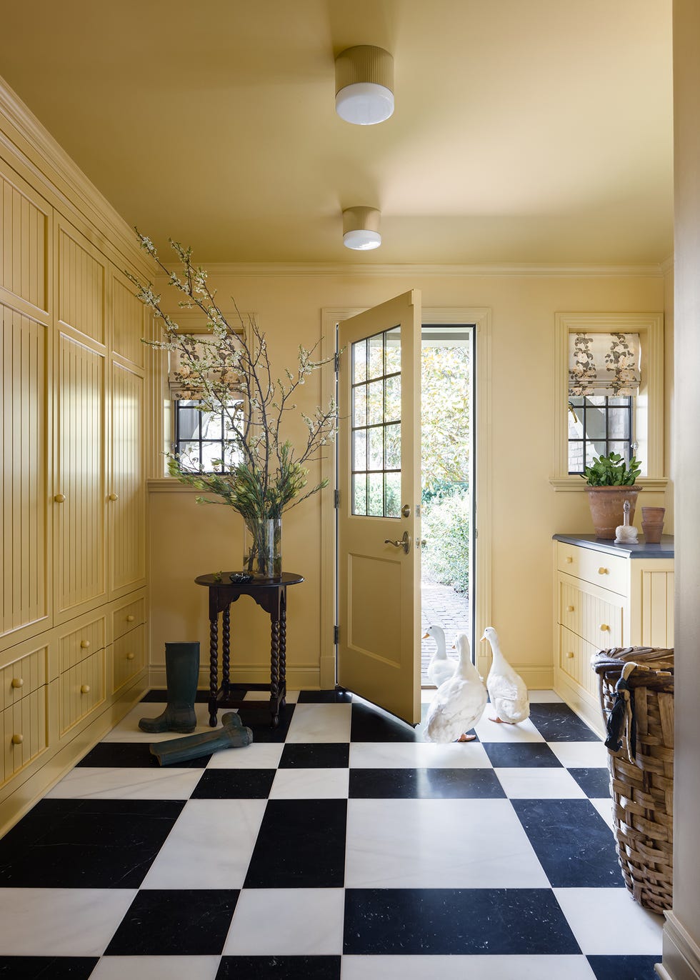 yellow entryway with checkered flooring