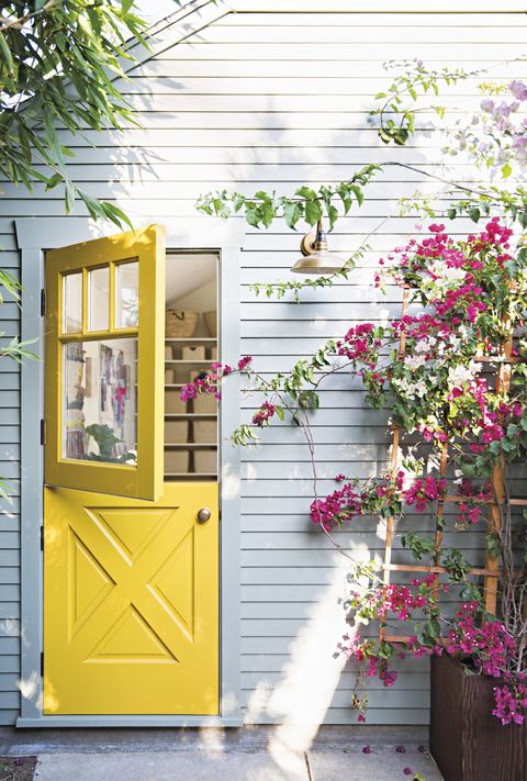 gray house with a yellow door