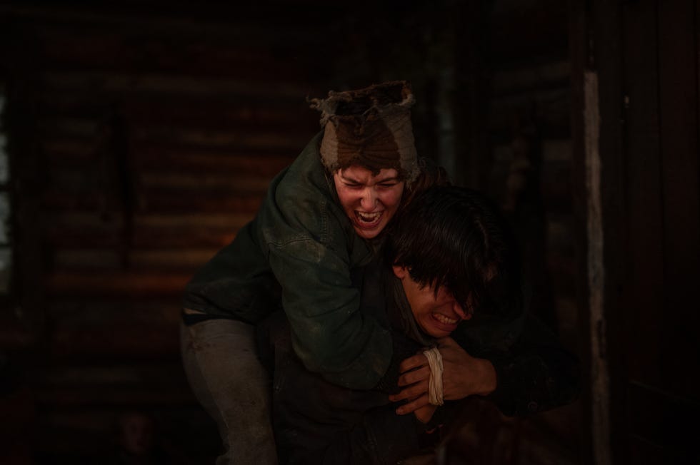 sophie nélisse as teen shauna tackling kevin alves as teen travis in yellowjackets