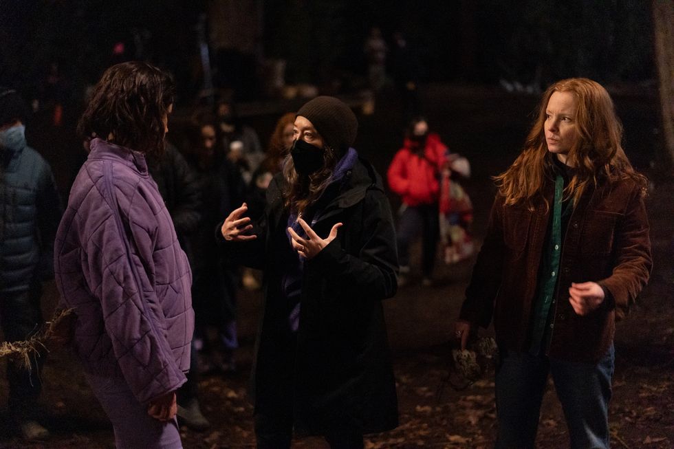 l r behind the scenes with juliette lewis, executive producer and director karyn kusama and lauren ambrose on the set of yellowjackets, "storytelling" photo credit colin bentleyshowtime