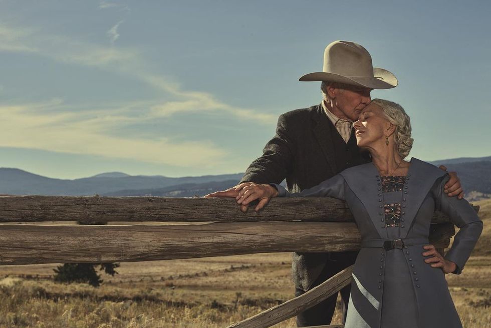harrison ford and helen mirren share a kiss standing out in the countryside in yellowstone 1923