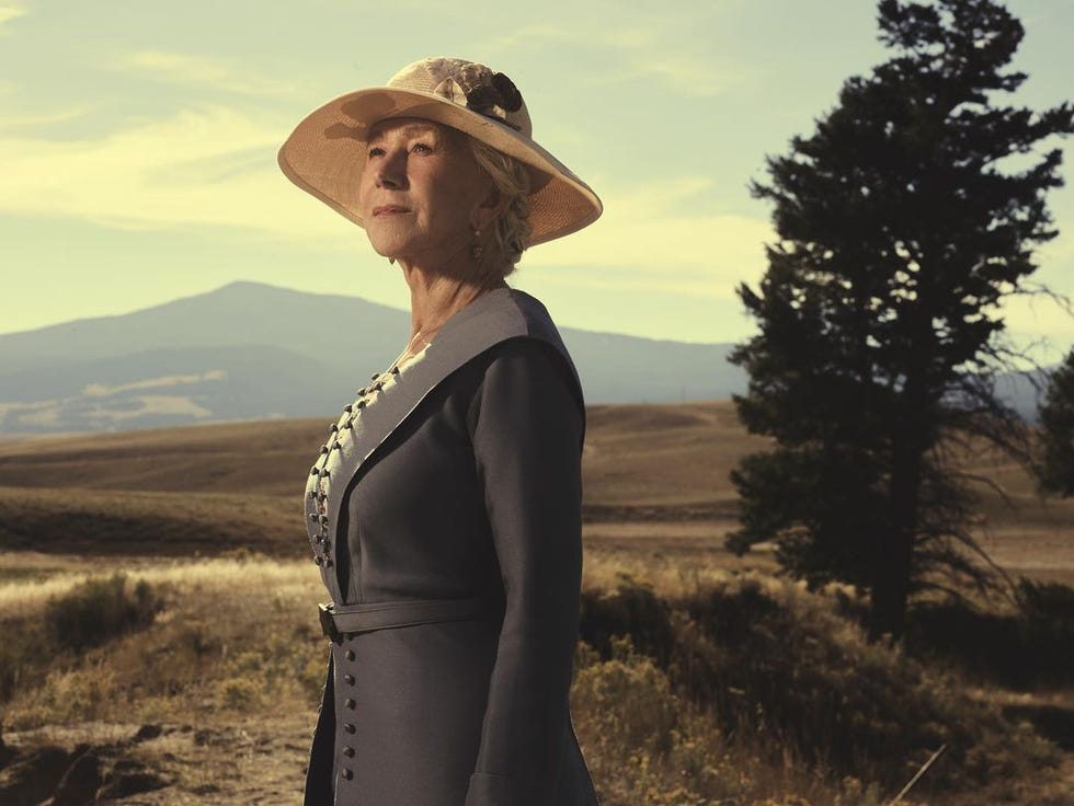 helen mirren wearing a hat standing in the countryside in yellowstone 1923