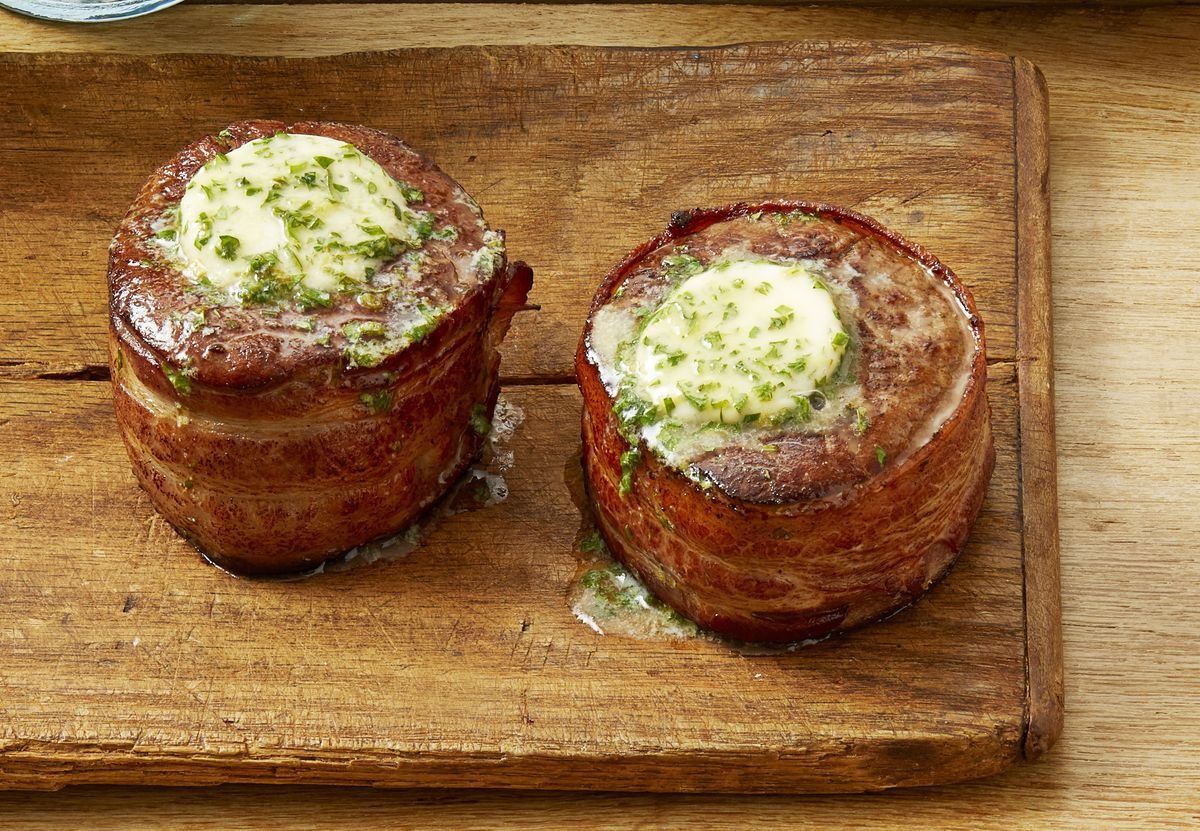 https://hips.hearstapps.com/hmg-prod/images/yellowstone-inspired-recipes-bacon-wrapped-filets-with-cowboy-butter-641b476bba069.jpeg