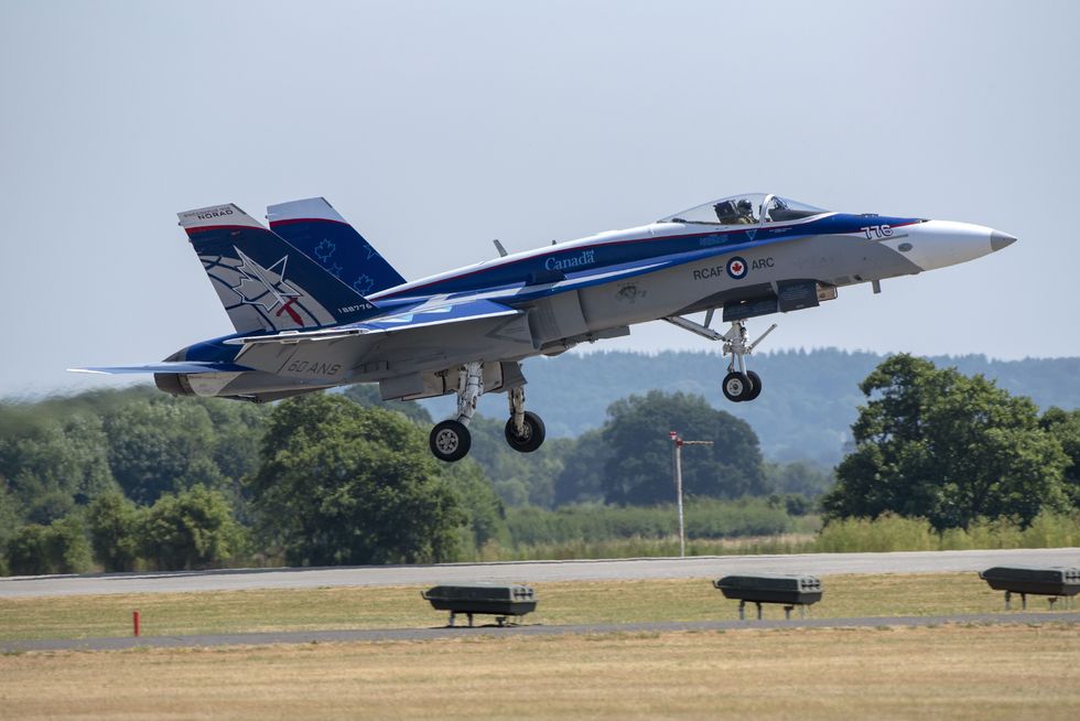 yeovilton royal naval air station, somerset, uk friday 6 july a canadian air force twin tailed fighter jet, cf 18 hornet landing, for saturdays air show