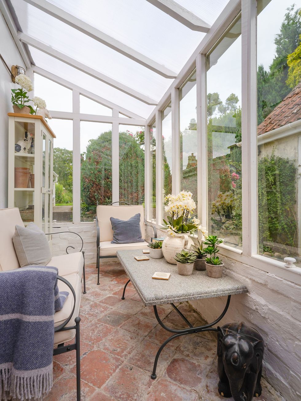 conservatory with sofa and plants