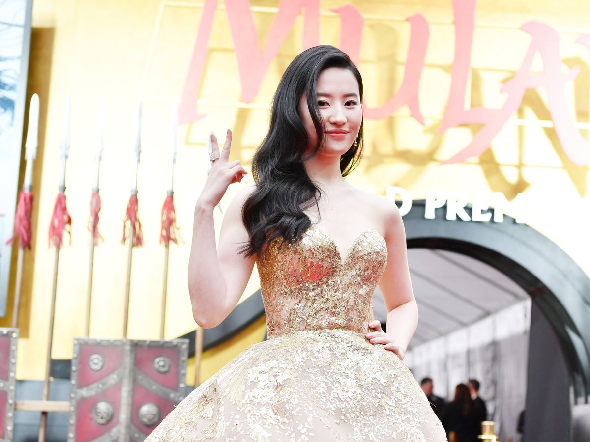 Mulan' Star Yifei Liu on Her Regal Gold Phoenix Gown at Hollywood Premiere  (Exclusive)