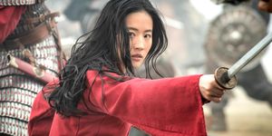 liu yifei as mulan with her sword ready for battle
