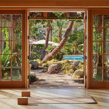 a room with glass doors and a view of the ocean a room with glass doors and a view of the ocean