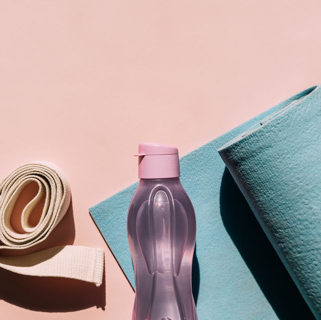 yoga props exercise mat, bottle of water and belt