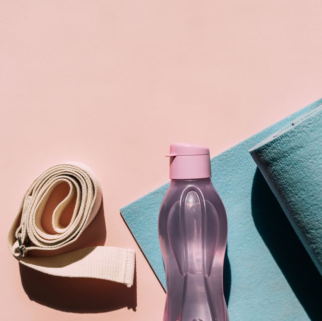yoga props exercise mat, bottle of water and belt