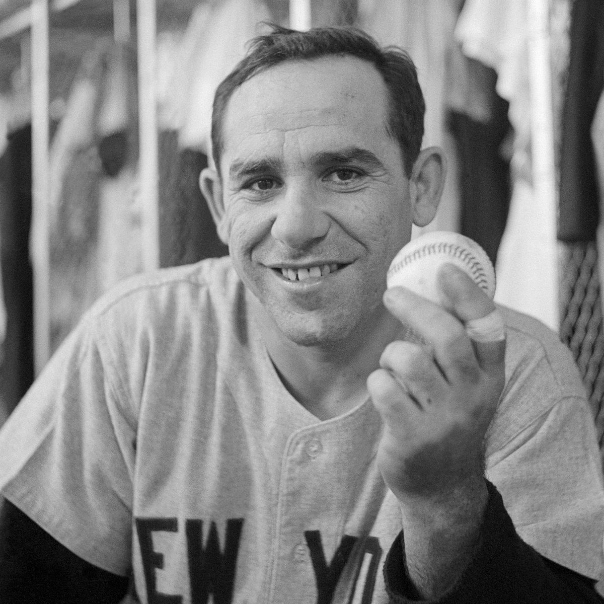 Yogi Berra Holding Home Run Record Setting Baseball(Original Caption) Yankee Yogi Berra set a new home-run record for catchers when he hit the 237th homer of his career during the 5th inning of the New York-Detroit game on September 14th. In this photograph, Berra holds the ball which he hit to make the new record.