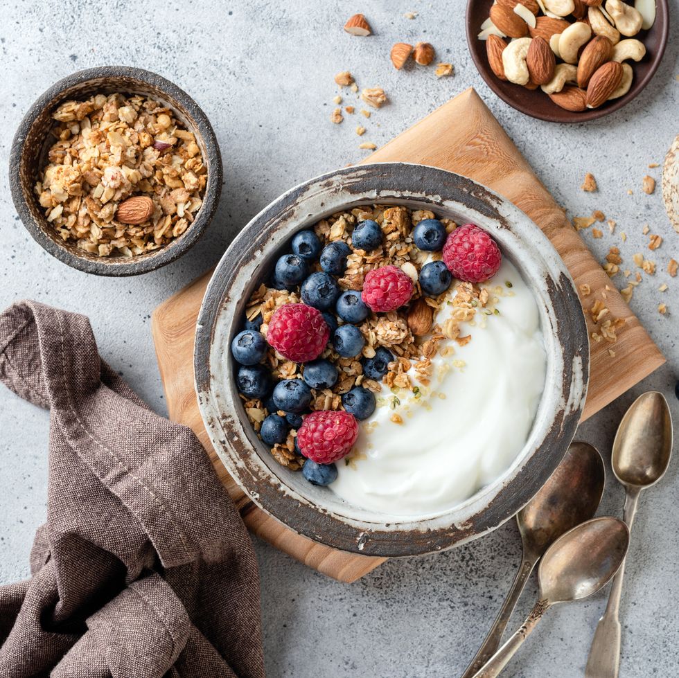 yogurt granola bowl with berries for good housekeeping's high calorie snacks
