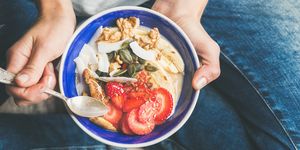 Yogurt, granola, seeds, fresh, dry fruits and honey in bowl