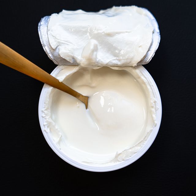 yogurt in bowl on wooden table. healthy eating