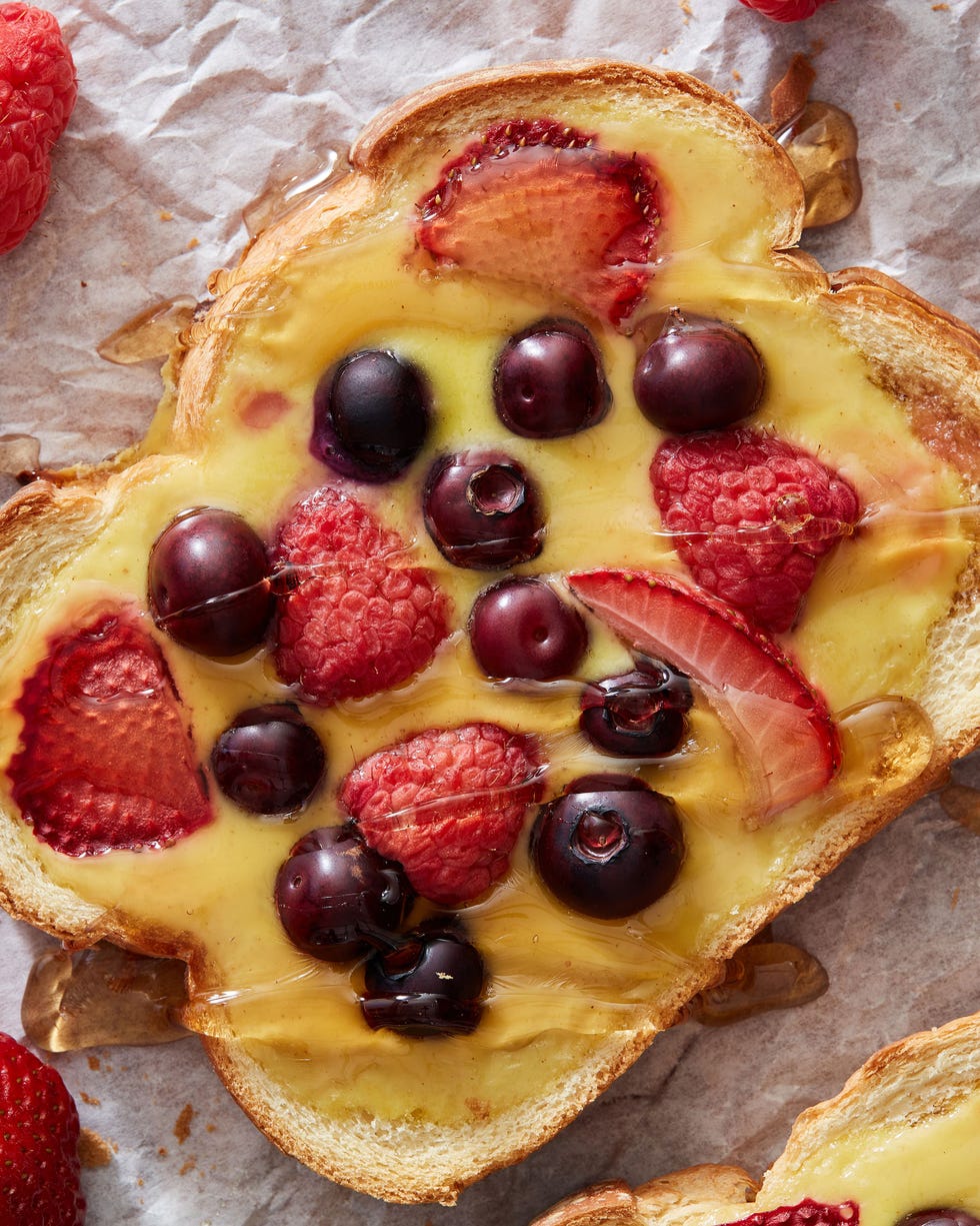 yogurt toast topped with berries and maple syrup