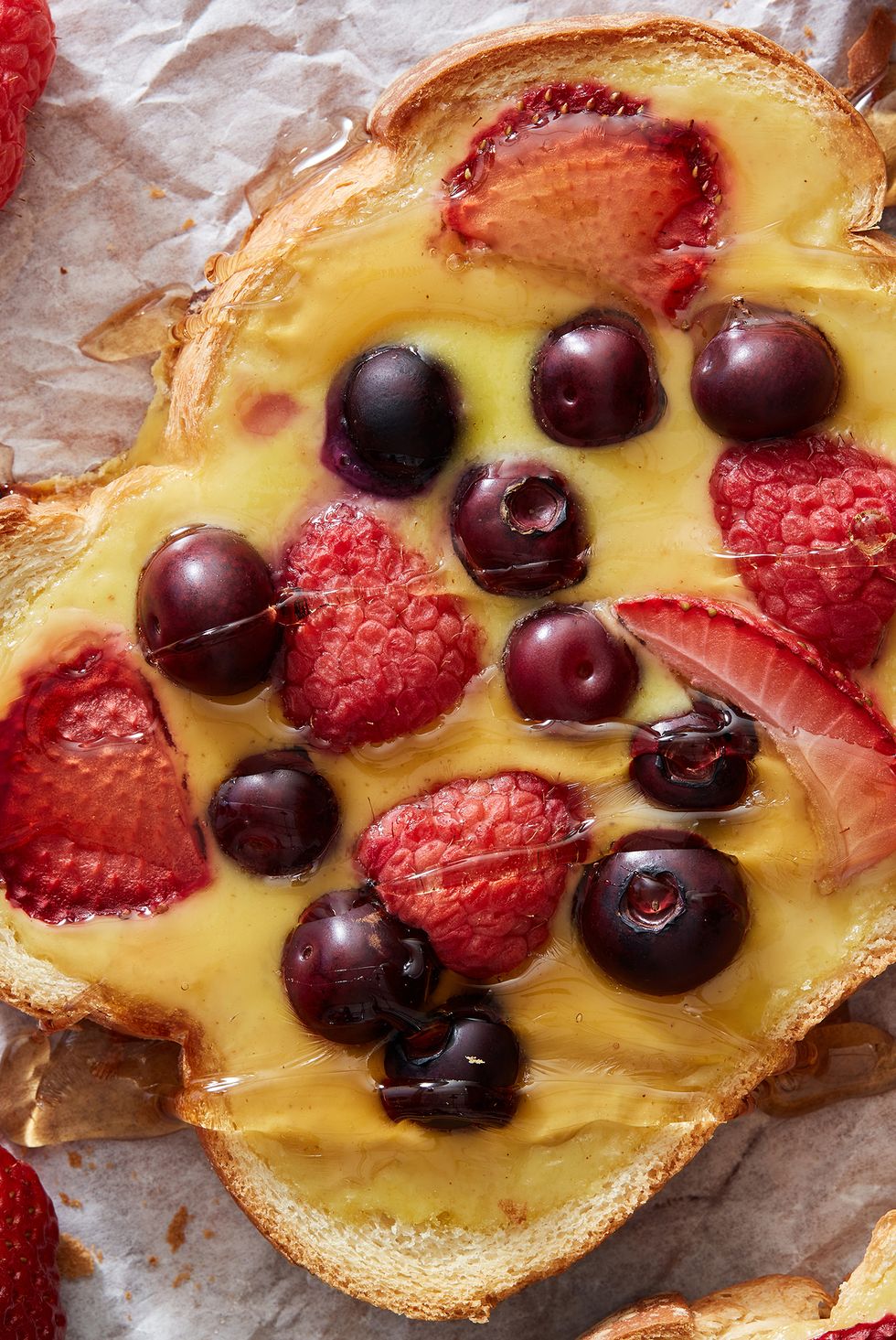 yogurt toast topped with berries and maple syrup