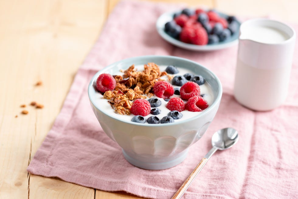 yogurt with granola and berries in bowl