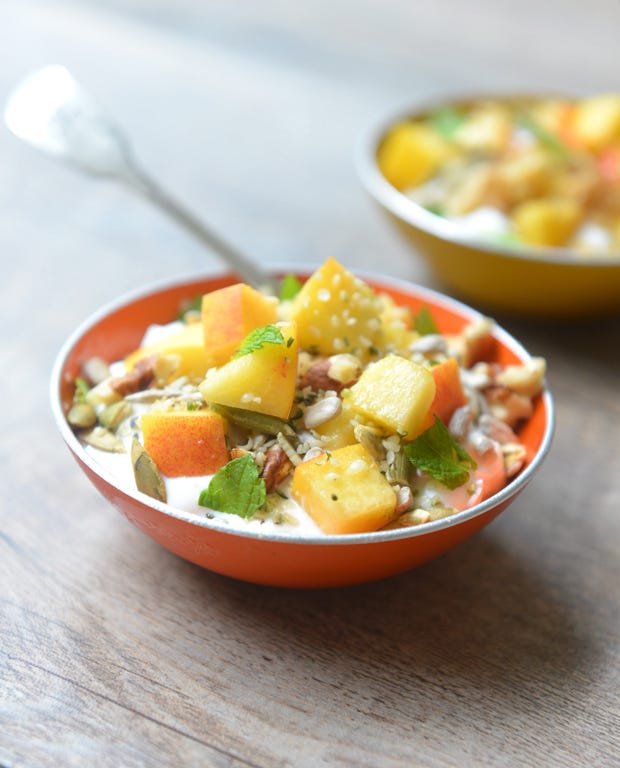 Yogurt with seeds, peaches, mint