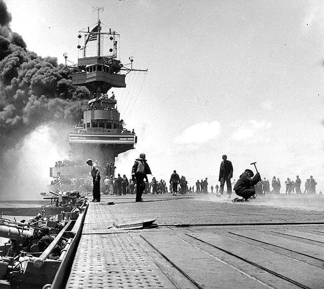 uss yorktown emits smoke after being struck by japamese bombers during the battle of midway﻿