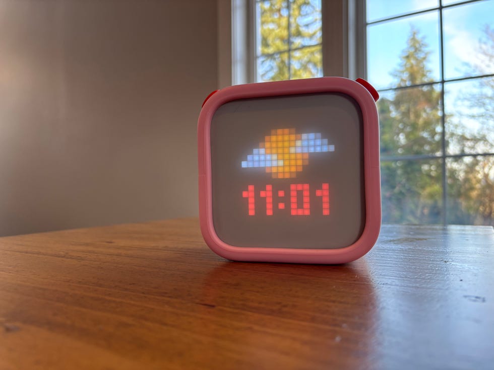 digital clock display showing time and weather icon