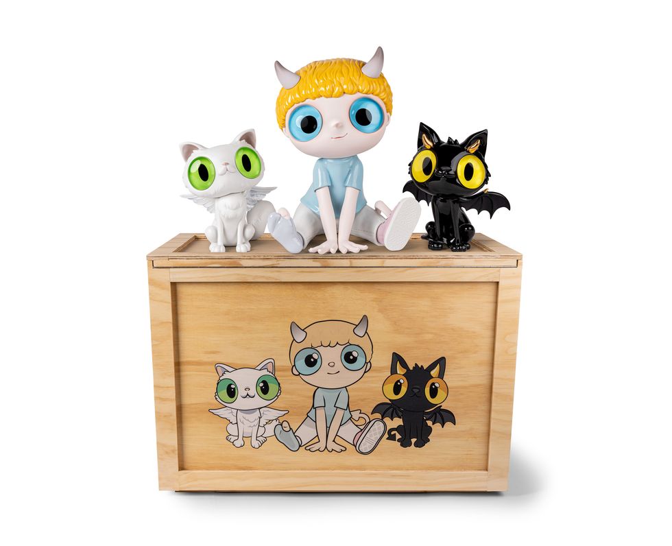 a group of cats on a wooden box