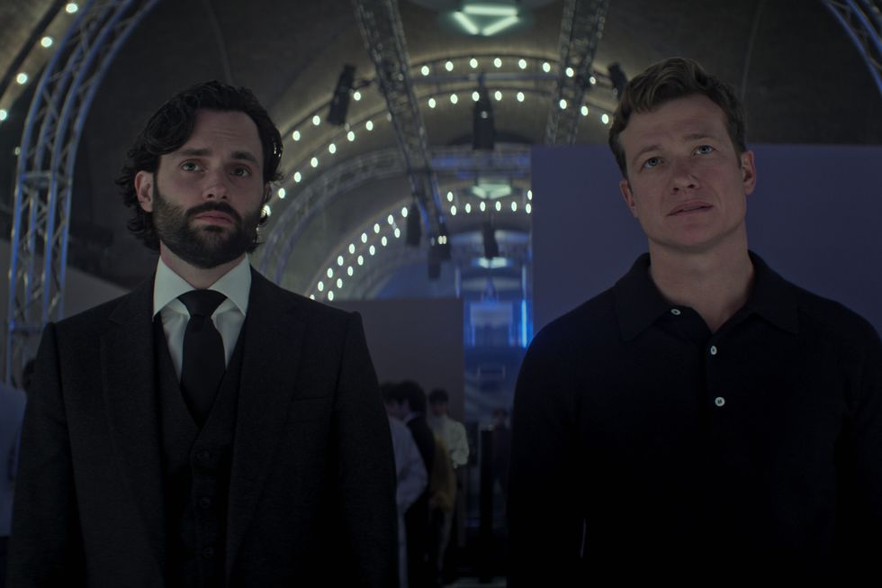 you l to r penn badgley as joe goldberg, ed speleers as rhys in episode 402 of you cr courtesy of netflix © 2022