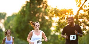 young adults running a marathon stock photo