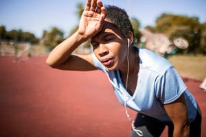 young african american woman resting after running