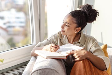 young writing notes