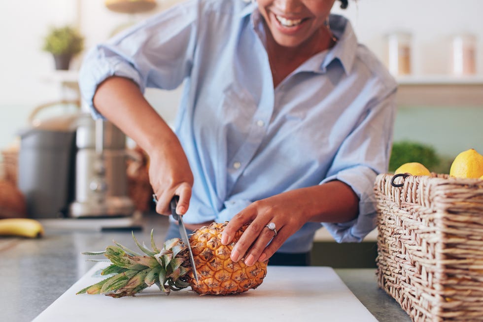 woman cutting fruit