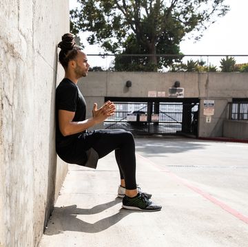 young afroamerican man getting fit in los angeles downtown city streets