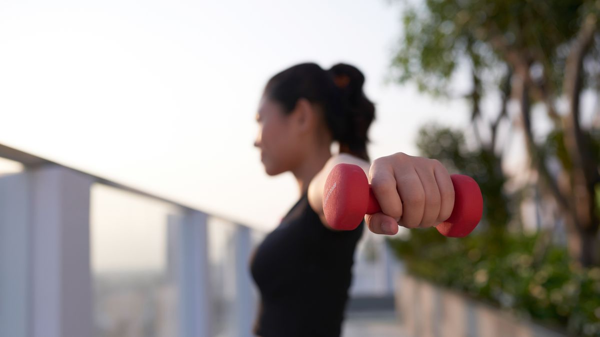 https://hips.hearstapps.com/hmg-prod/images/young-asian-girl-excercising-with-dumbbell-outdoor-royalty-free-image-1689184367.jpg?crop=1xw:0.84296xh;center,top&resize=1200:*