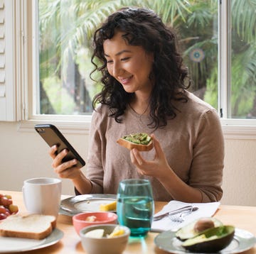 young asian woman eating a healthy breakfast