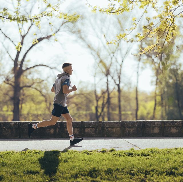 young athlete running alone in nature