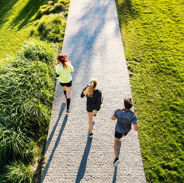 Young athtletes in the city running in park.