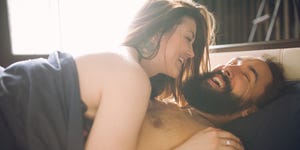 young beautiful man with a woman sleeping in the bed view from above