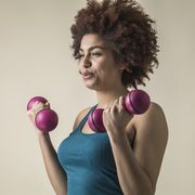 young black female excercising with weights