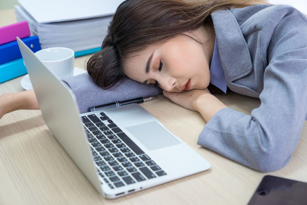 Young business woman sleeping in the office, Work hard concept.