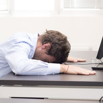 Young businessman fallen asleep in the office